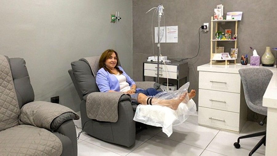 Patient receiving a localized ozone boot therapy session