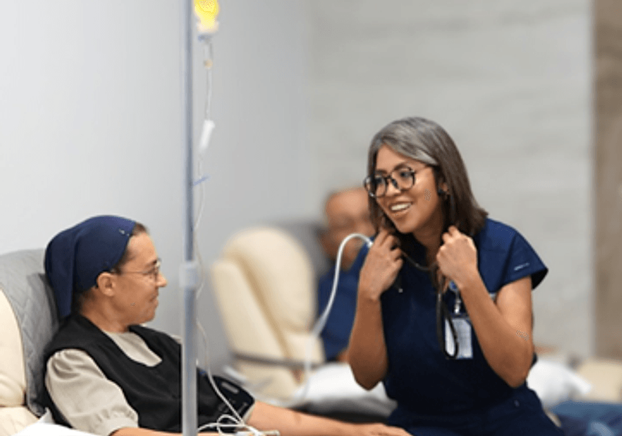 Patient receiving a relaxed, supervised chelation infusion with a nurse