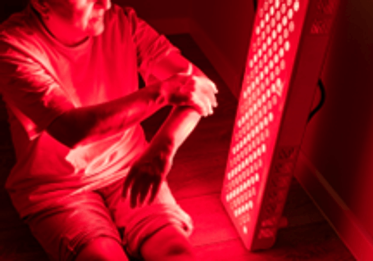 Patient receiving a red light therapy session